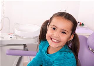 Cute Little Girl In Dental Chair