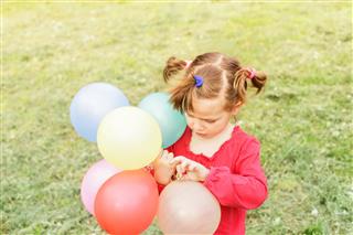 Little Girl With Balloons
