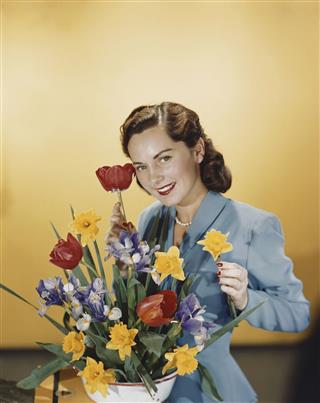 Young Woman Arranging Flowers