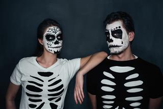 Couple In Costume Of Skeletons