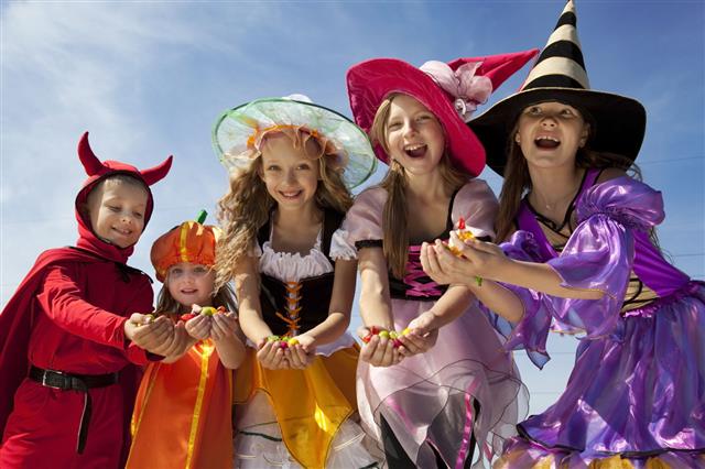 Five Halloween Children Holding Candies