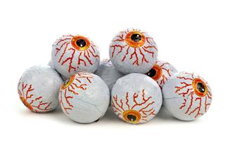 Pile Of Halloween Candy Eyeballs Over White
