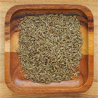 Cumin Seeds In A Wooden Tray