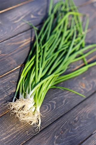 Chives On Wooden Table