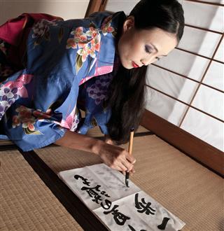 Japanese Geisha Writing A Calligraphic Type