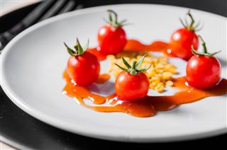 Small Tomato And Beans On Dish