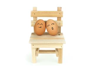 Lover Eggs Flirting On Wooden Chair