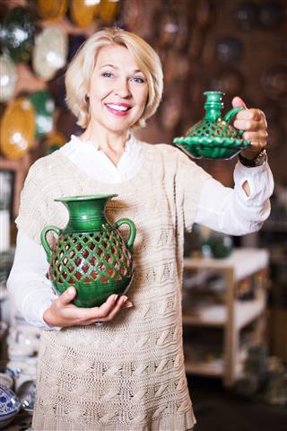 Woman Buying Ceramic Tableware
