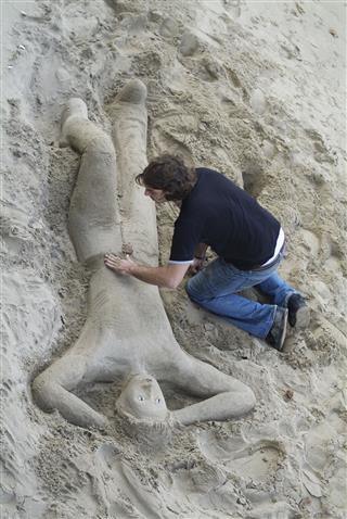 Sand Sculpture And Artist