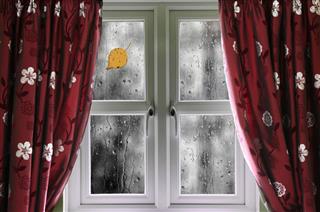 Rain On A Window With Curtains