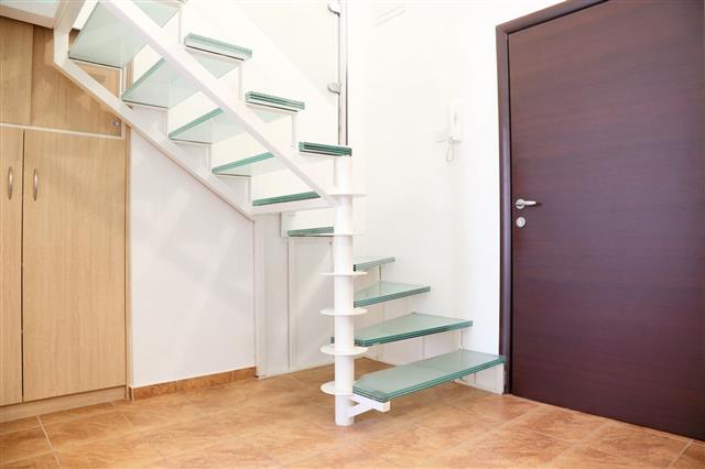 Entrance To Apartment With Circular Stairs