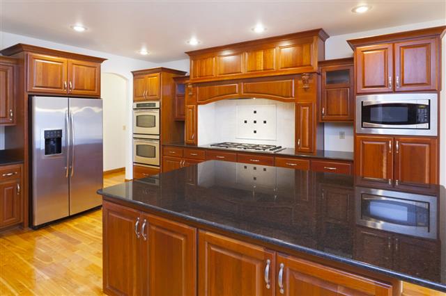 Kitchen With Custom Hardwood Cabinets