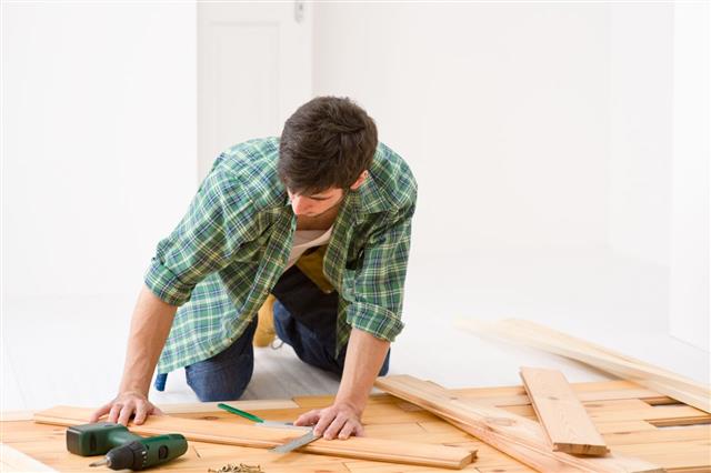 Handyman Installing Wooden Floor