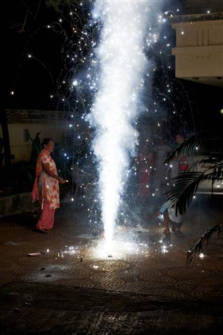 Young Indian Boy Celebrating Diwali Fireworks