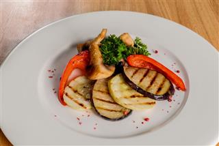 Grilled Vegetables On A White Plate