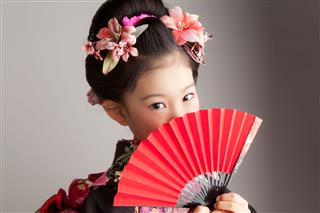 Japanese Girl With A Red Fan