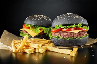 Black Burgers With French Fries