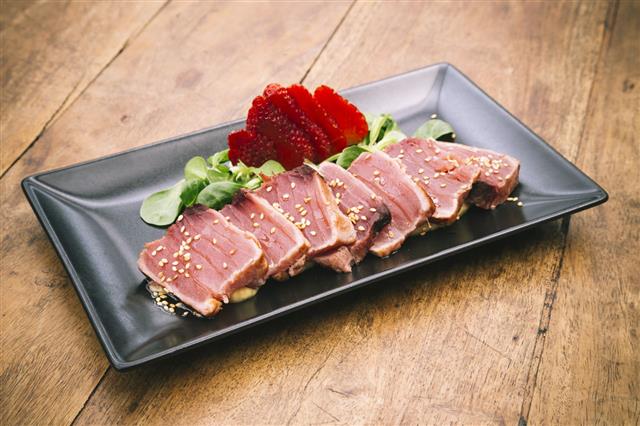 Tuna Tataki Dish On Wooden Table