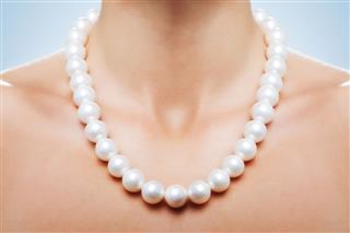 White Pearl Necklace On Womans Neck