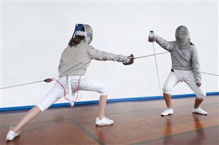 Girls With Masks And Outfits Fencing