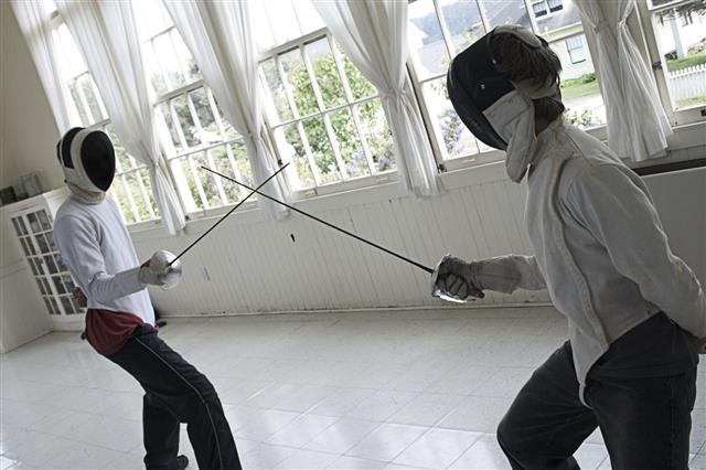 Two People Fencing