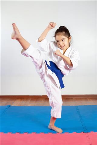 Children During Training In Karate Fighting Position