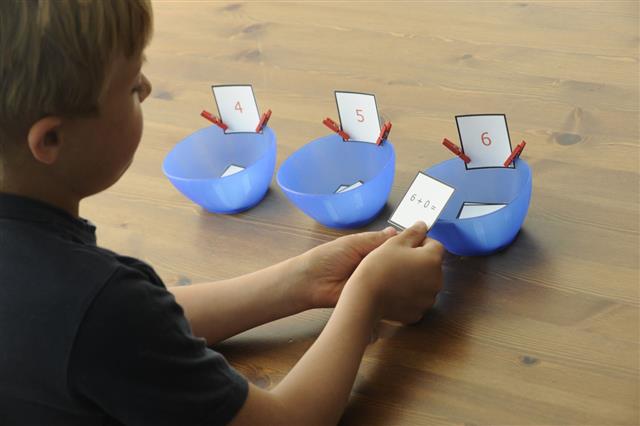 Boy Sorting Sums With Bowl