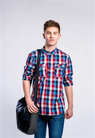 Boy In Jeans And Shirt