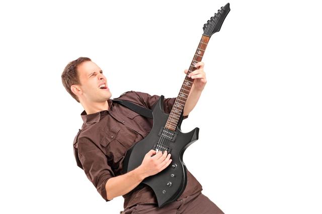 Young Man Playing Electric Guitar