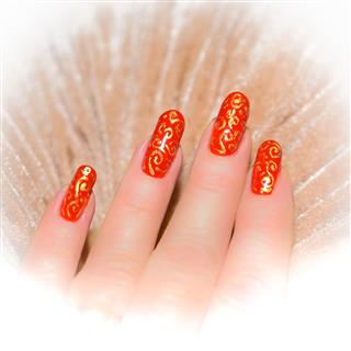 Red nails with gold pattern