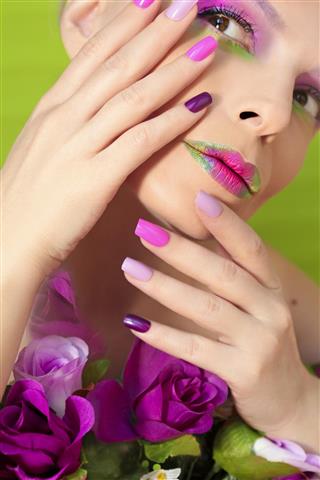 Colorful lilac manicure and lips