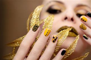 Yellow black manicure