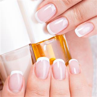 Beautiful woman nails with french manicure