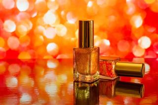 Two nail polish bottles on abstract background