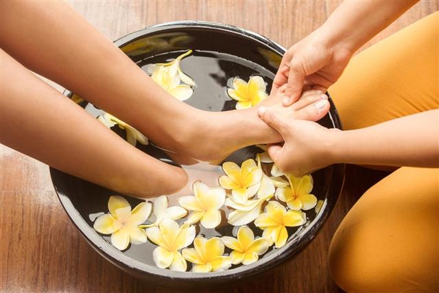 Feet massage in spa salon