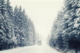 Truck In Blizzard Driving Thru Snow