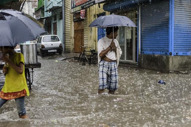 Man With Umbrella During Flood Varanasi