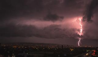 Lightning Over City During Thunderstorm