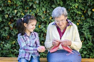 Girl Knitting With Grandmother