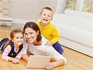 Mother And Children Using Digital Tablet
