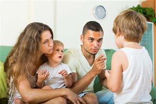Parents Scolding Child In Home