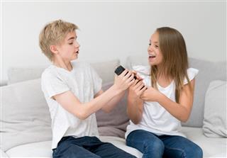 Kids Fighting Over The Remote Control