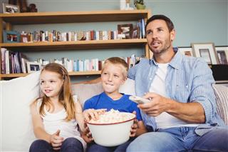 Smiling Family With Popcorns