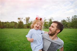 Father With Daughter In Park