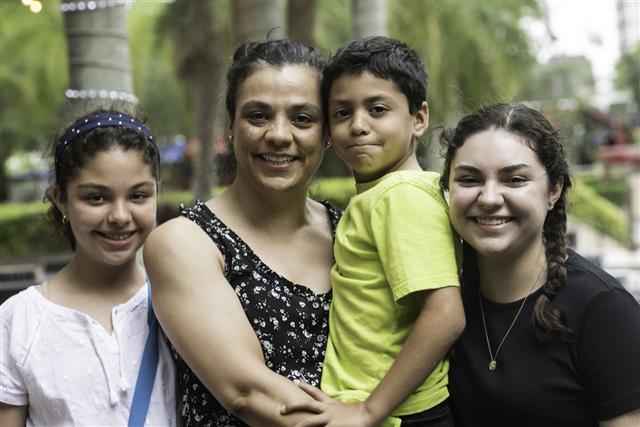 Hispanic Woman With Her Children