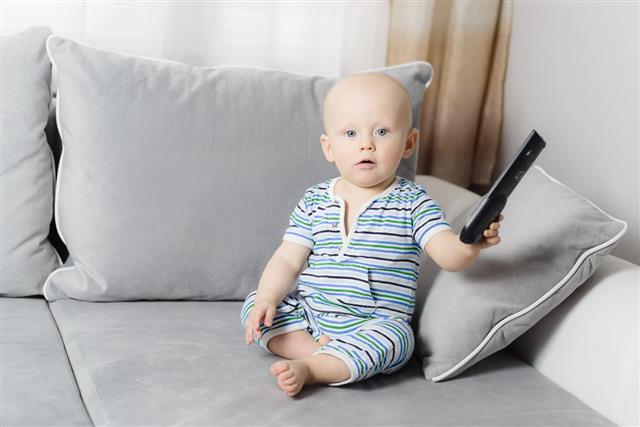 Baby Holding TV Remote