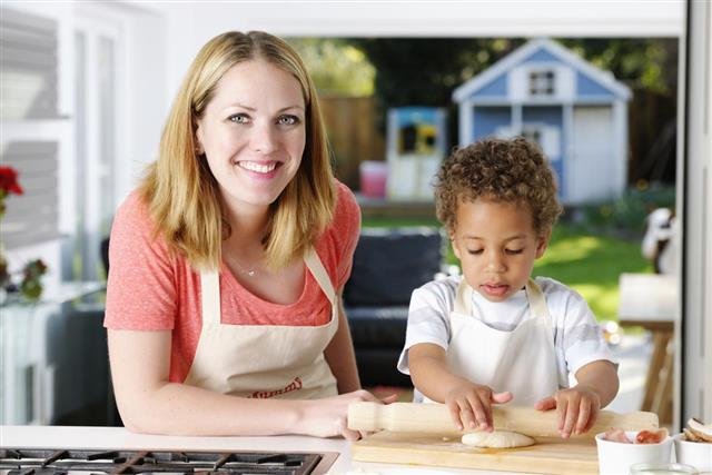 Toddler Preparing Pizza with Woman