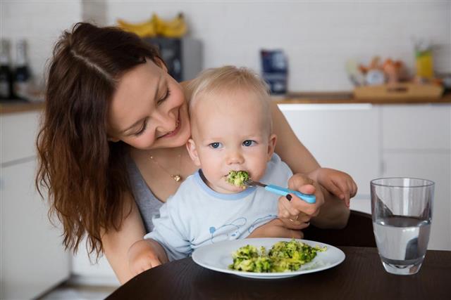 Woman and Child Eating Together