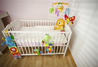 Cot For Baby With Colorful Toys
