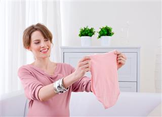 Woman With Baby Clothes